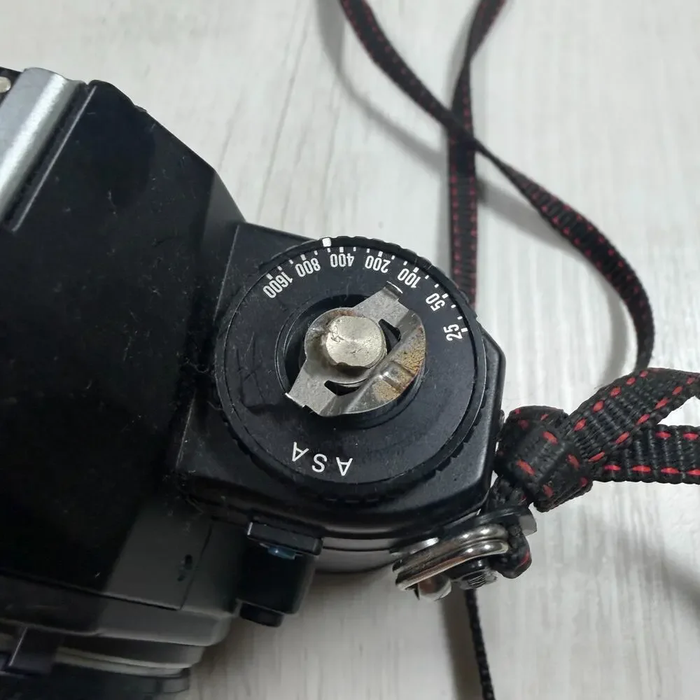 Nikon EM 35mm Film SLR Camera Body, Black (Body Only) for parts or repair